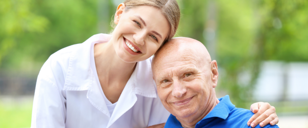 caregiver woman embracing an elderly man